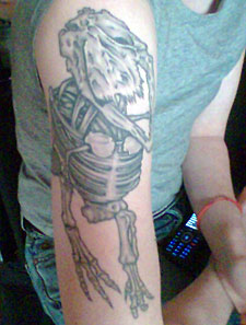 Dinosaur tattoo by Shotsie Gorman